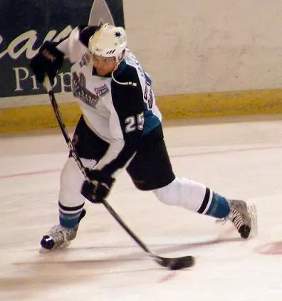 picture of hockey player during the impact stage of slapshot